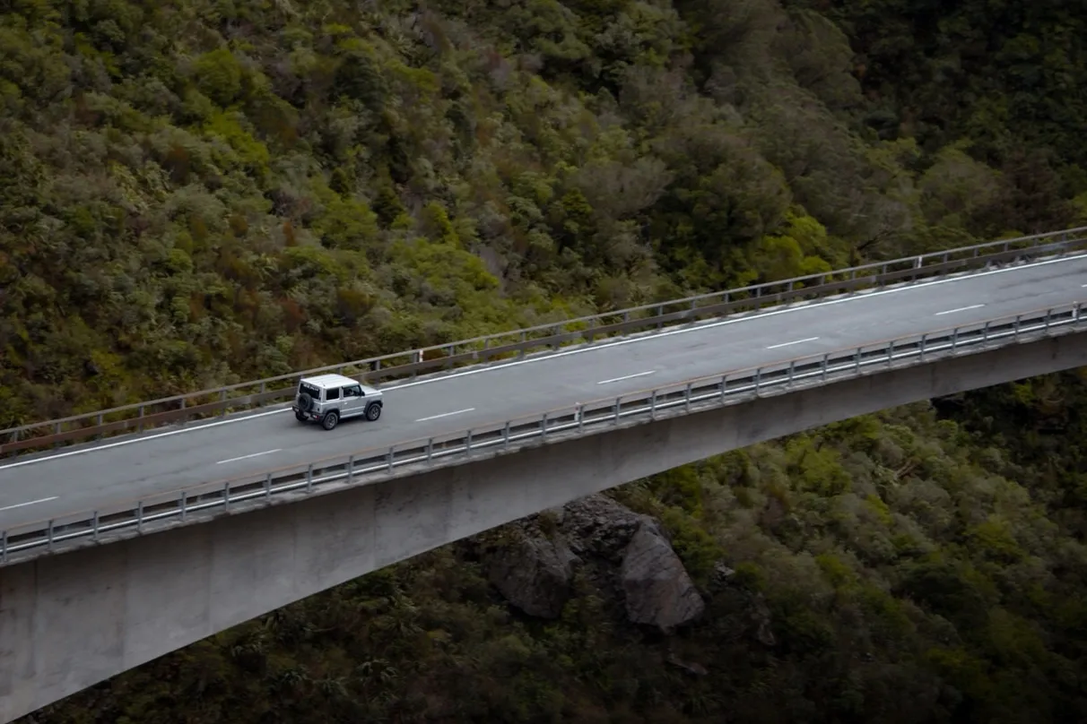 A Suzuki Jimny on a back-country road in the South Island high country.